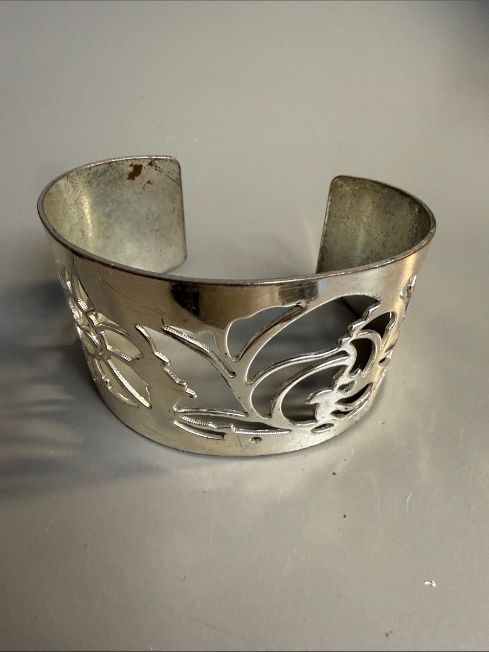 Avon Vintage Silver Tone Cuff Bracelet Featuring a Delicate Floral Cutout